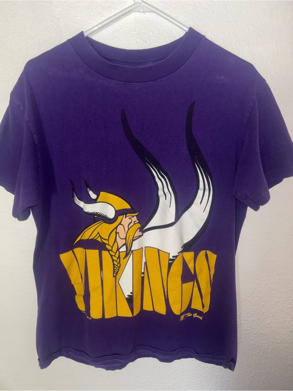 The Game Purple men’s Vikings Graphic Tee with Yellow Print